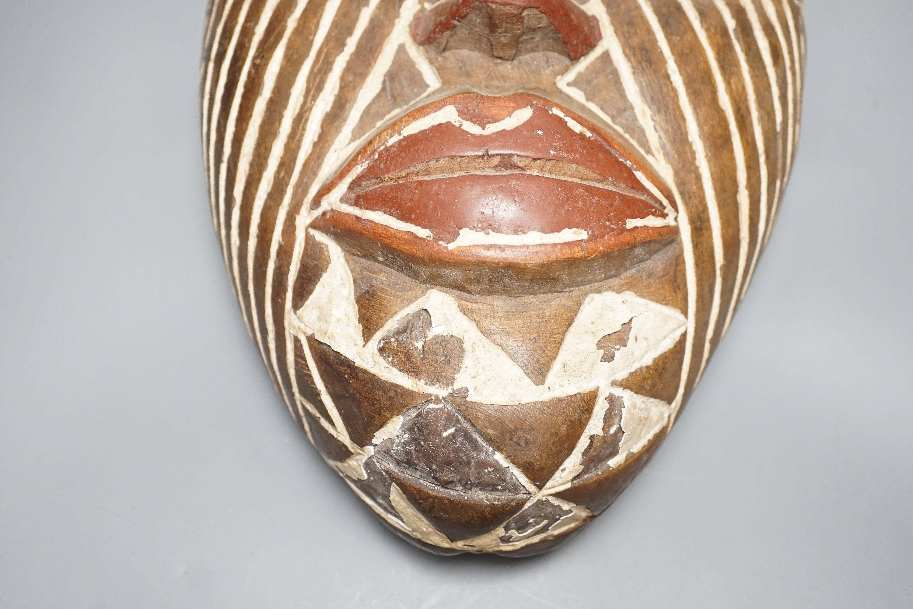 An African tribal mask, height 36cm